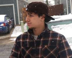 He has piercing in his ears.